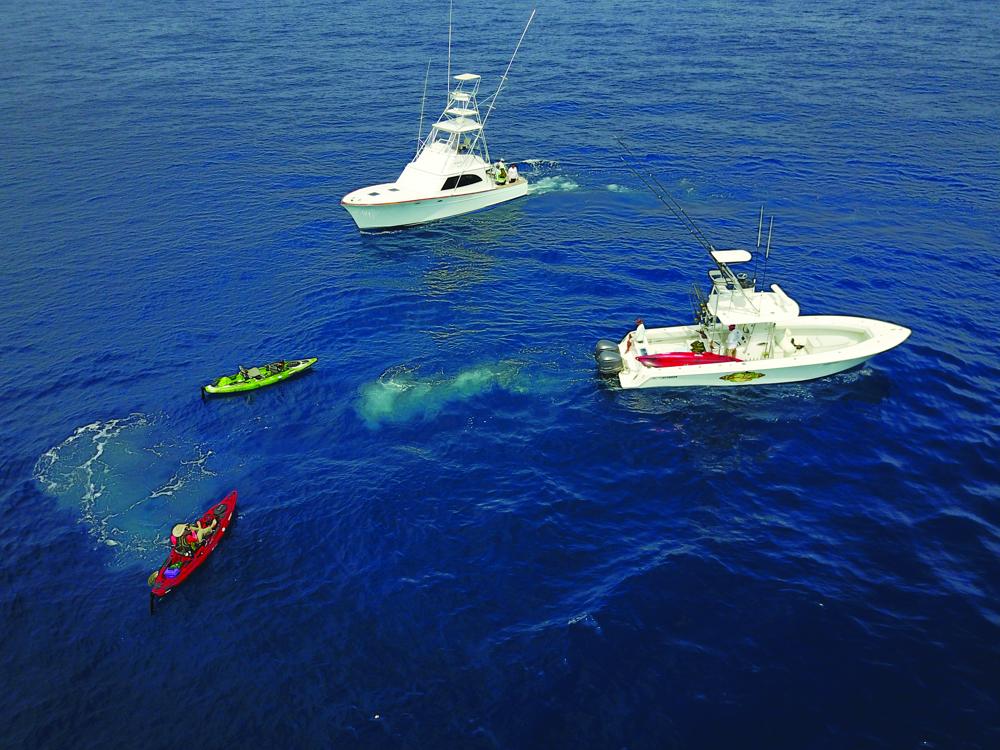 A aerial view of kayaks launching from mothership off Guatemala's Pacific coast