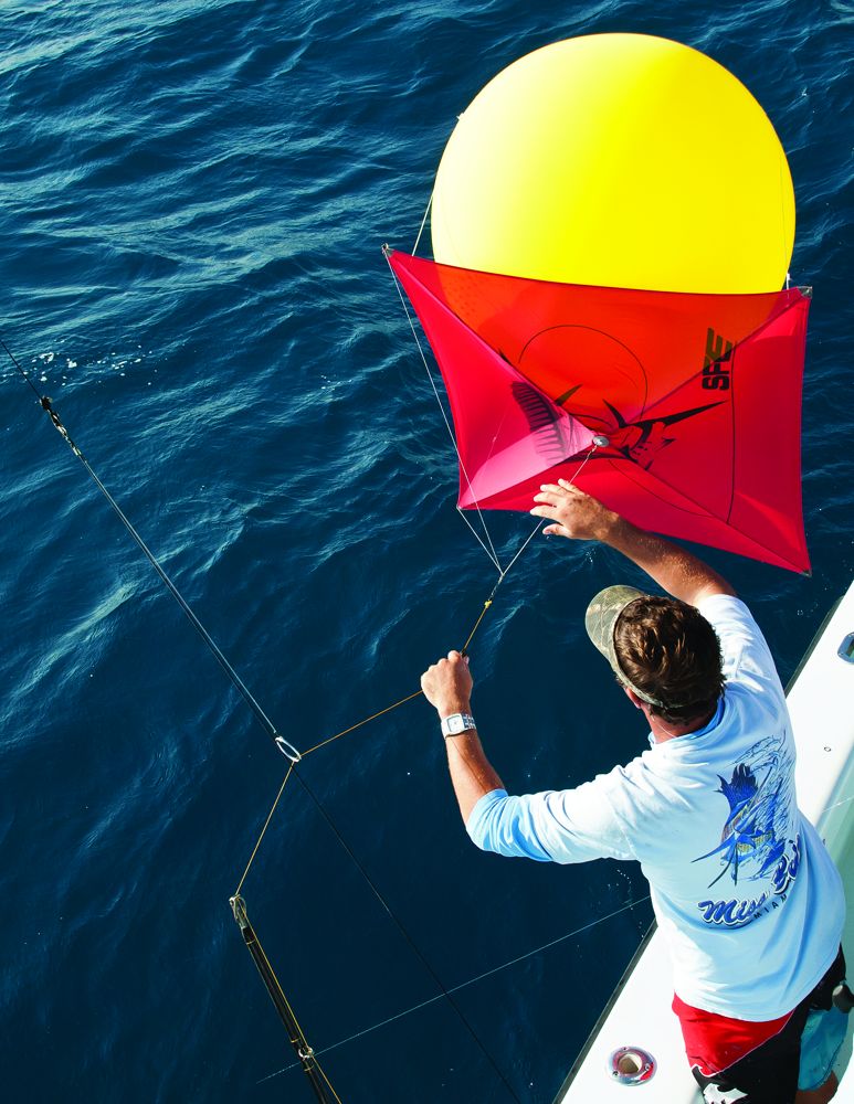 When winds die, a helium baloon will keep a kite aloft to dangle a live bait at the surface.