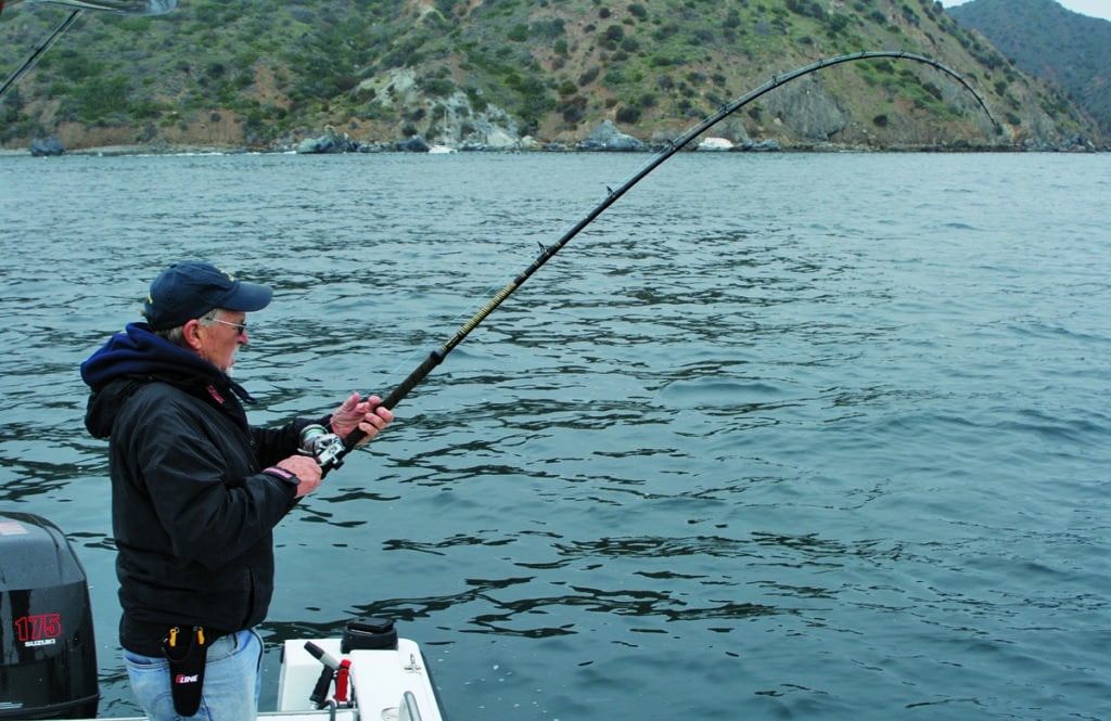 Angler fishing eight-foot rod with braided line Channel Islands