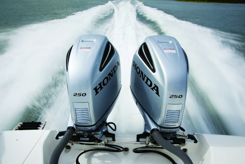Twin Honda outboard engines on a fishing boat transom
