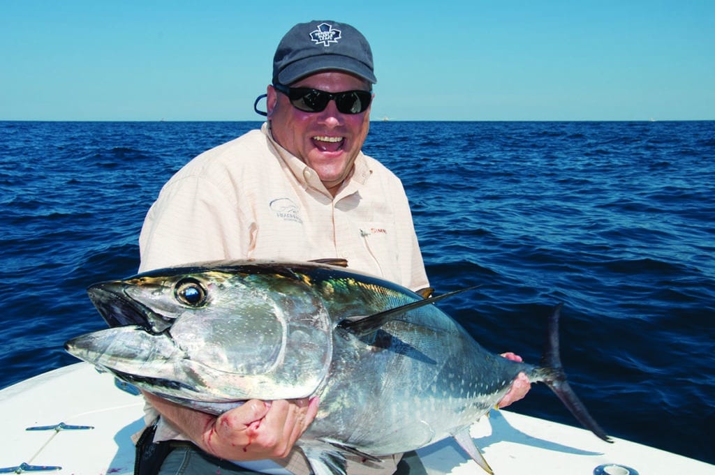Angler holding bluefin tuna
