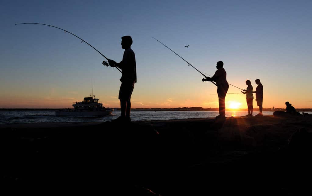 Anglers fishing from seawall