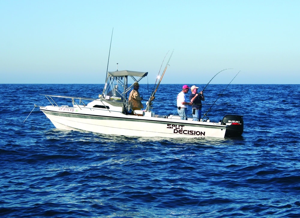 Sport fishing boat anchoring offshore on deep reefs