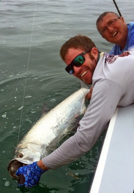 Releasing a tarpon, Capt. Jason Stock, named as a Top Charter Captain for 2017 by the fans of Sport Fishing magazine