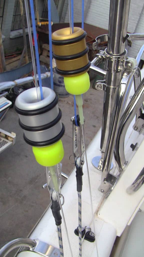 setting up offshore outriggers - closeup of tag weight resting on rope-end stopper
