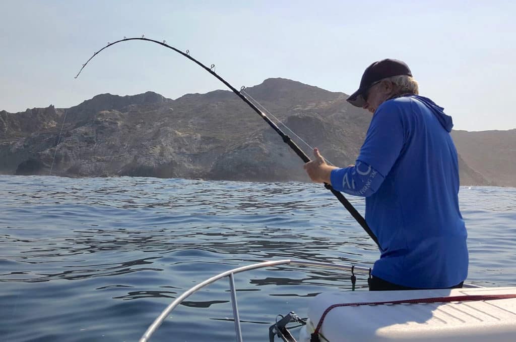 Angler Catching Calico Bass