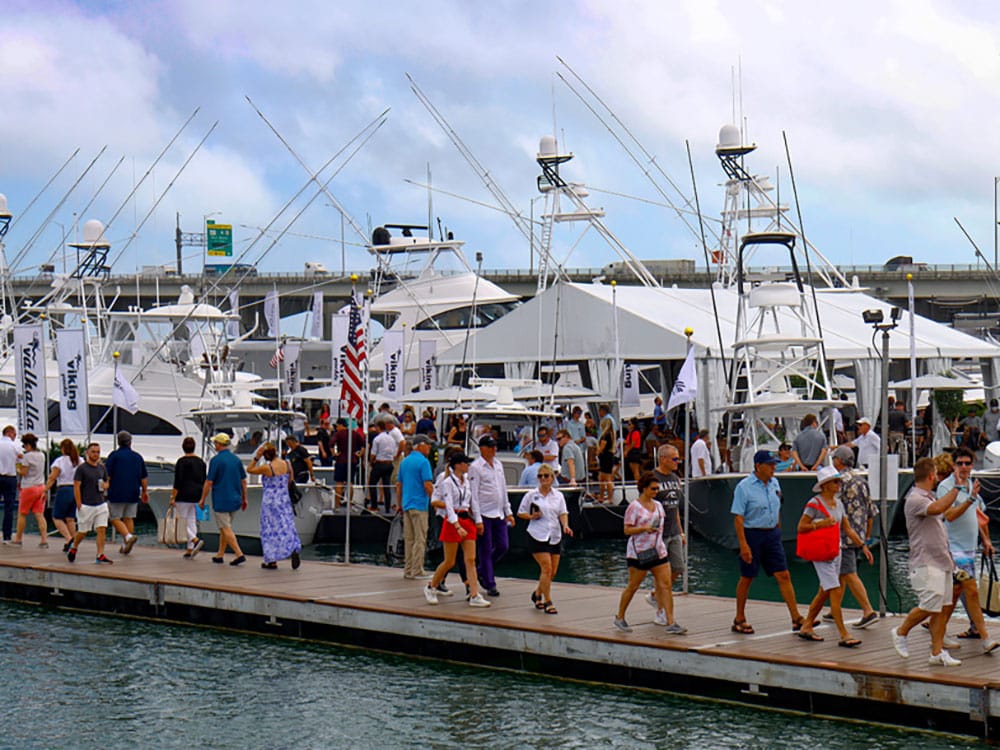 Miami Boat Show attendees walking the dock