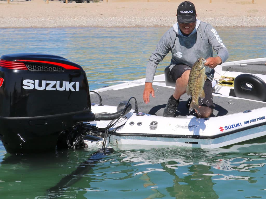 Angler holding up smallmouth bass on Lake Havasu