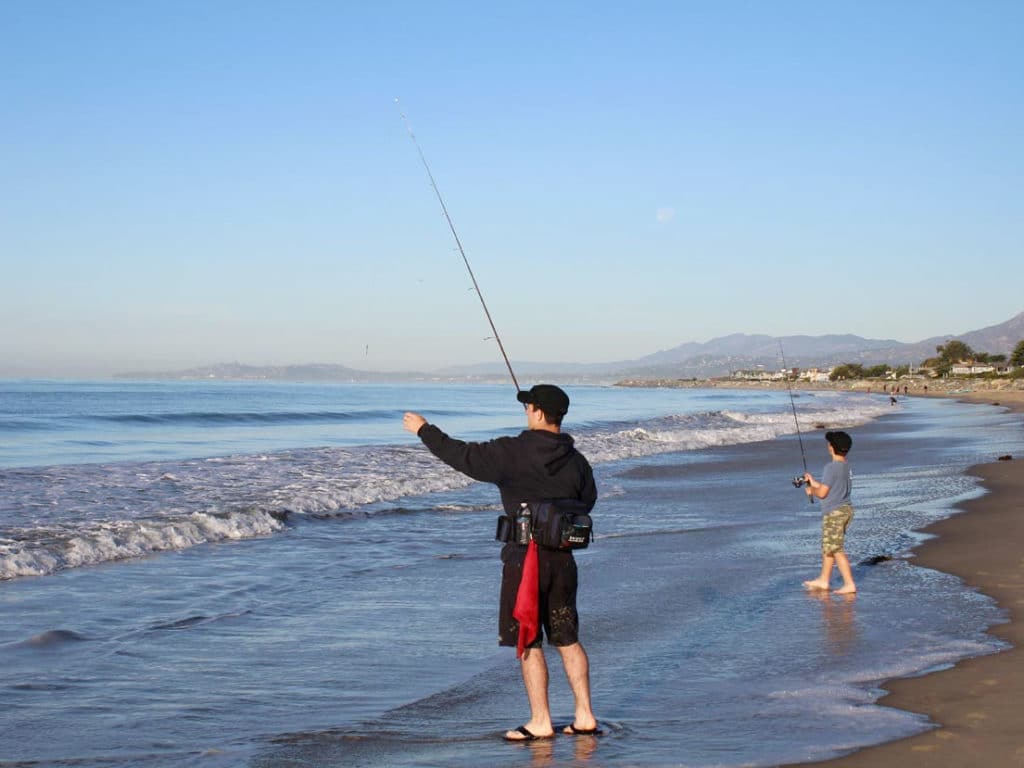 Two anglers fishing surf