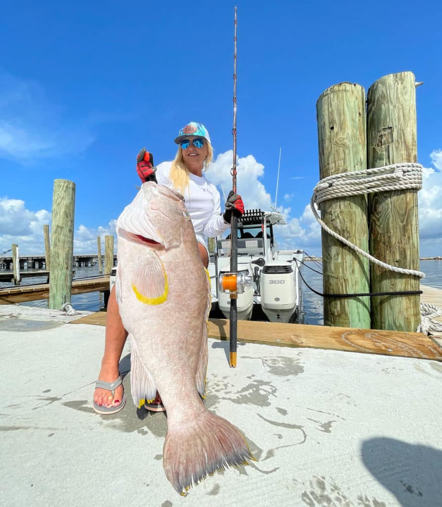 Sue Beiriger with a giant grouper