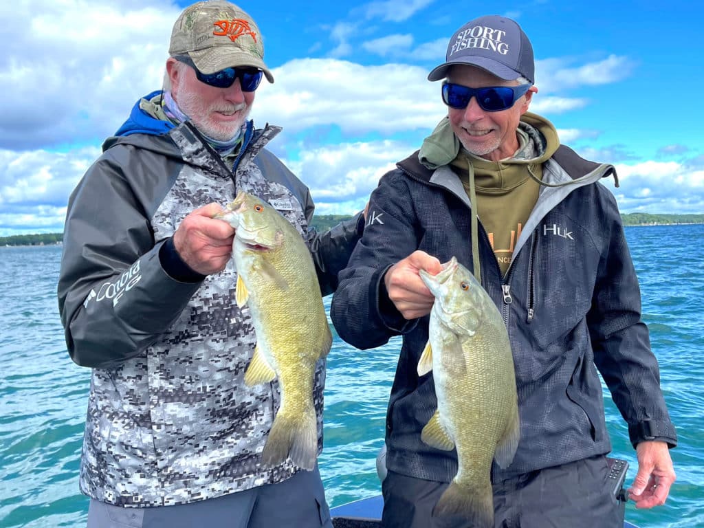 Two anglers with smallmouth bass