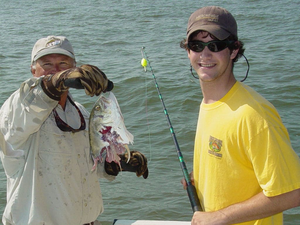 Anglers with half-eaten fish