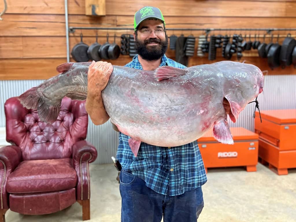 Christopher Halley with giant catfish