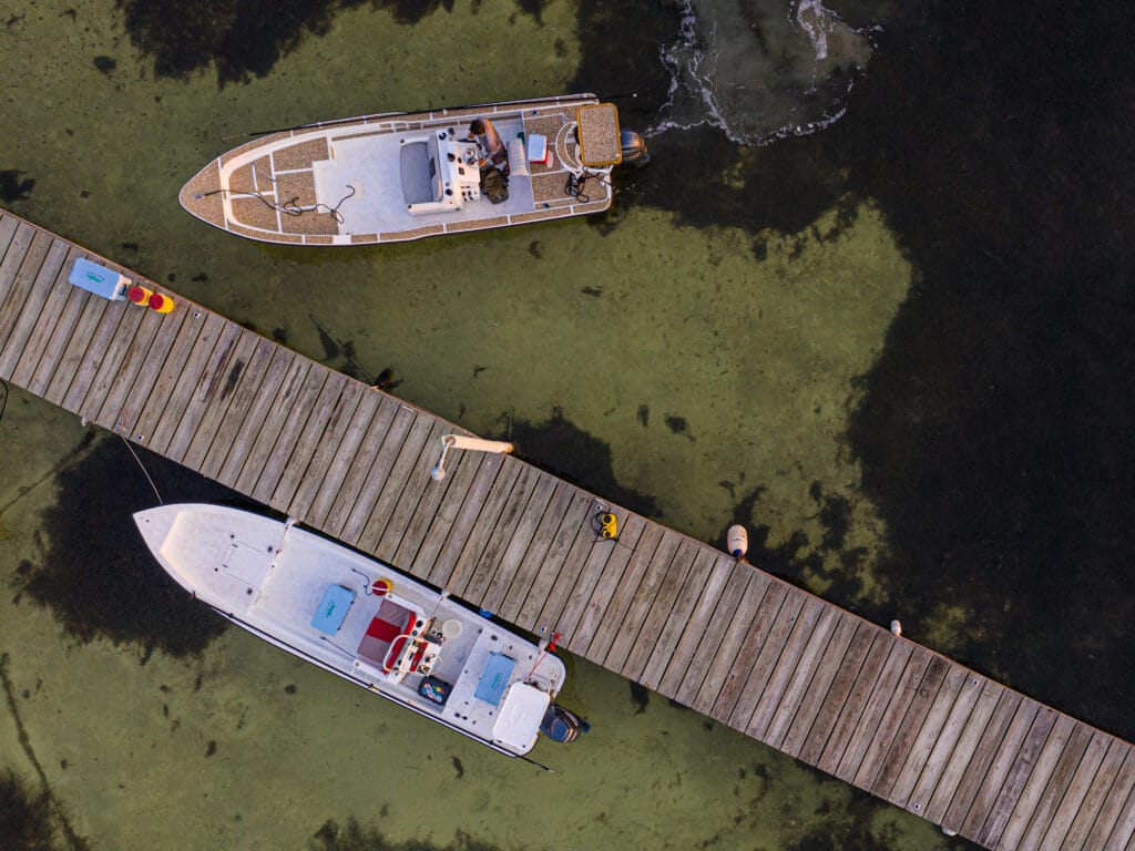 flats boats leaving the dock