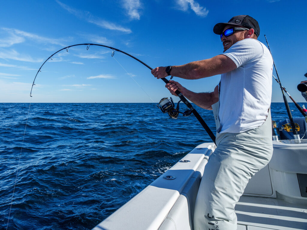 Angler fighting a fish offshore