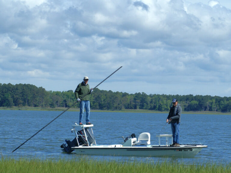 Poling a skiff on the Maryland coast.