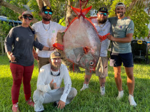 Anglers with a rare 148-pound opah caught off South Florida.