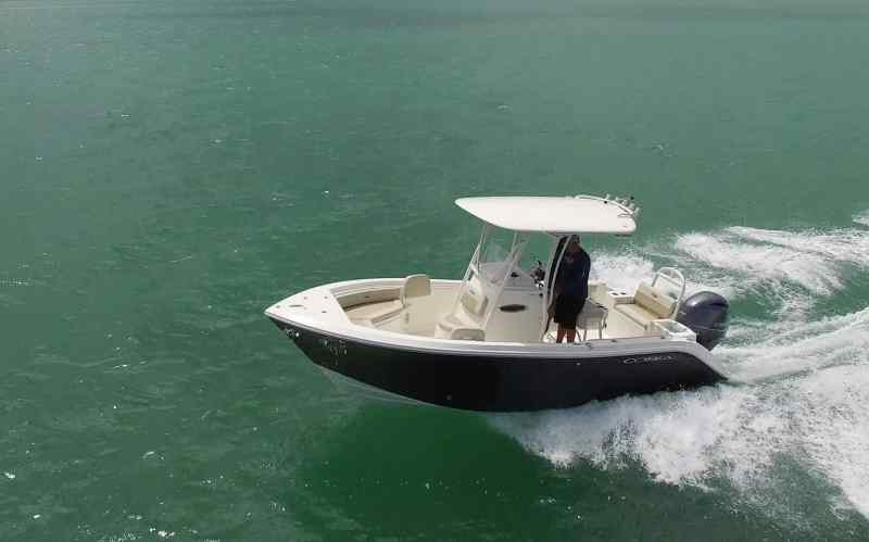 Cobia 220 CC cutting across the waves
