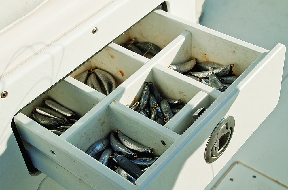 Banana and kidney sinkers in a boat fishing tackle station
