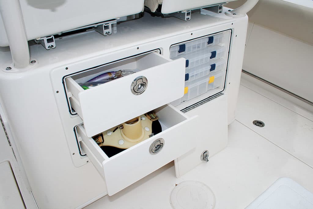 Cobia 261CC center console saltwater fishing boat abaft tackle storage