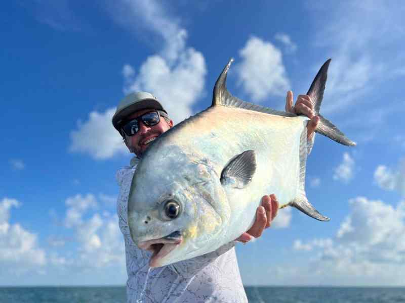 SPF0822-Mike-ward-with-permit Mike Ward holding large permit