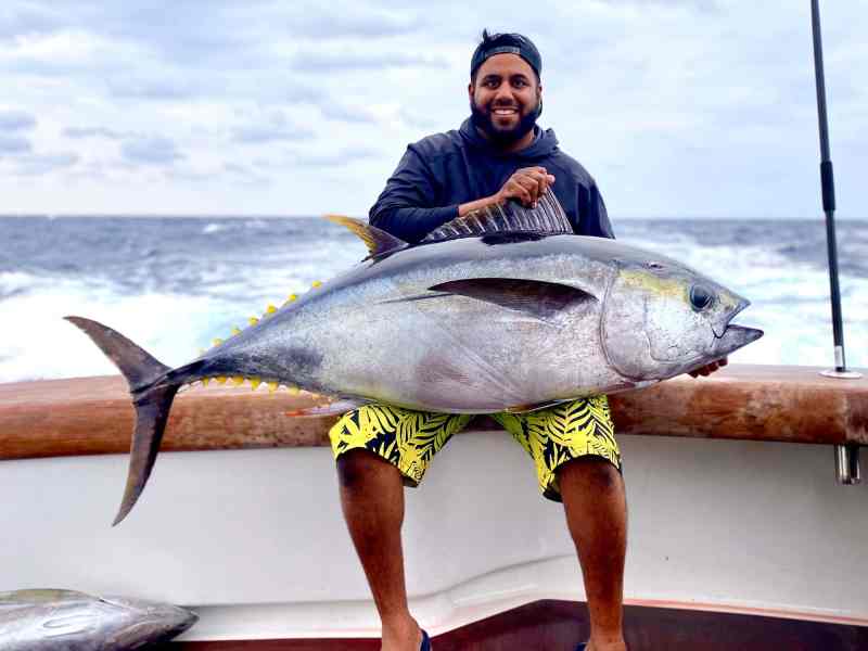 SPF0822-Weekly-Yellowfin-8422 Angler with a large tuna on board