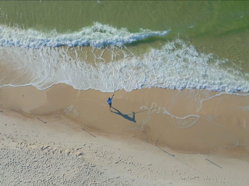 SPF424-Surf-Casting Angler casting from the beach