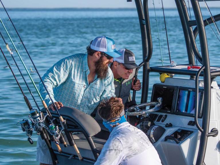 FBBG25-JS-MFDs-1 Anglers looking at MFDs