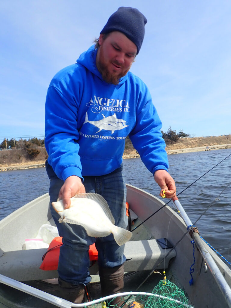 winter flounder in an aluminum boat