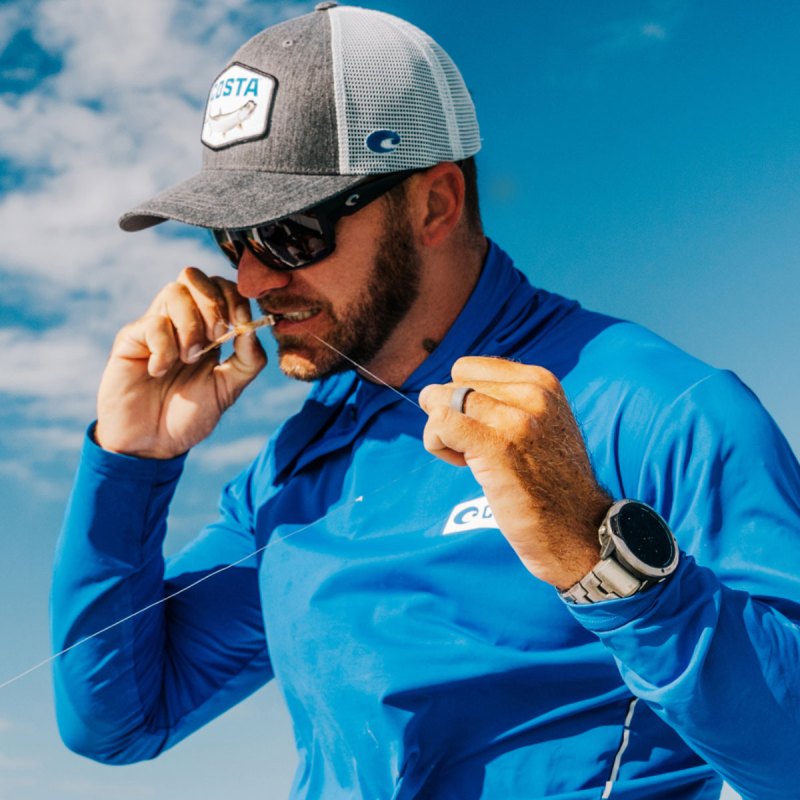 Angler wearing Costa Fly Line sunglasses