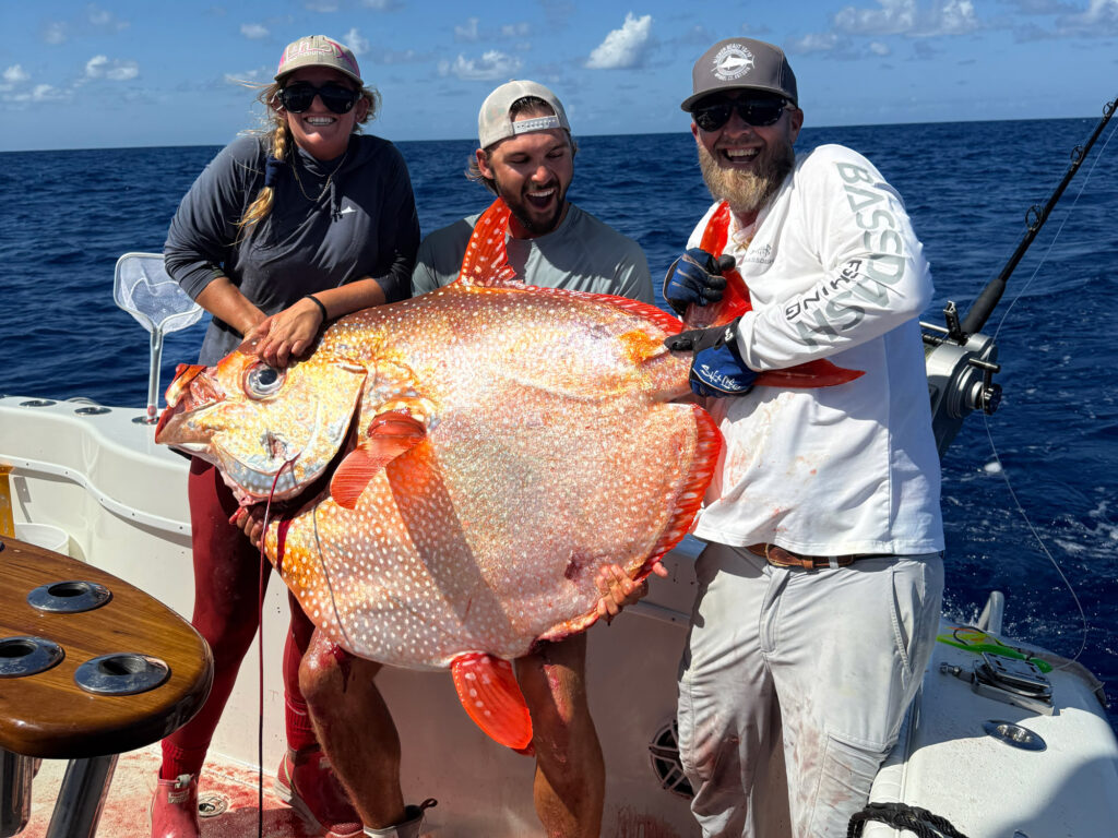 Captain and crew hold the opah