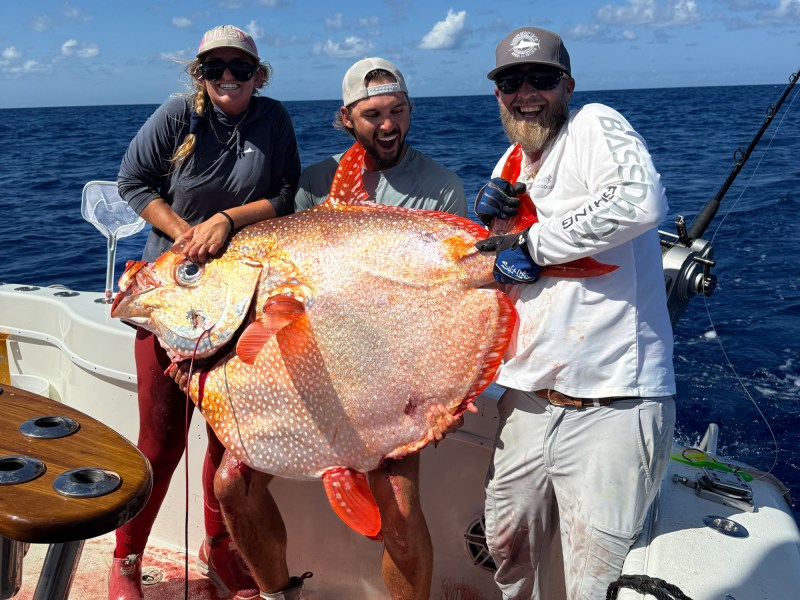 Captain and crew hold the opah