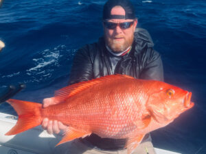Capt. Mike McFadden with the all-tackle world record blackfin snapper.