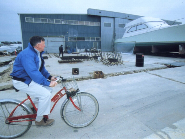 Bill Healey at Viking Yachts on a bicycle