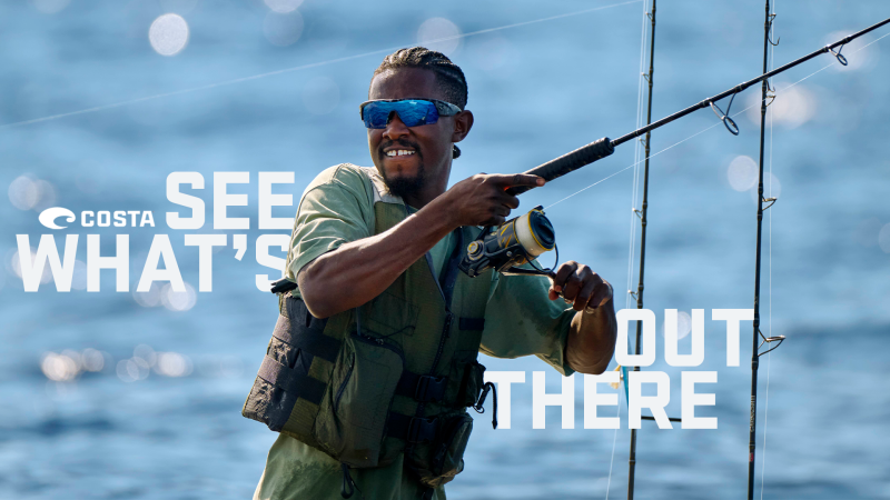 Angler wearing Costa sunglasses while fishing