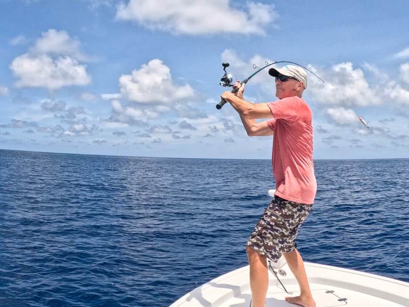 Angler casting a lure for Gulf amberjack