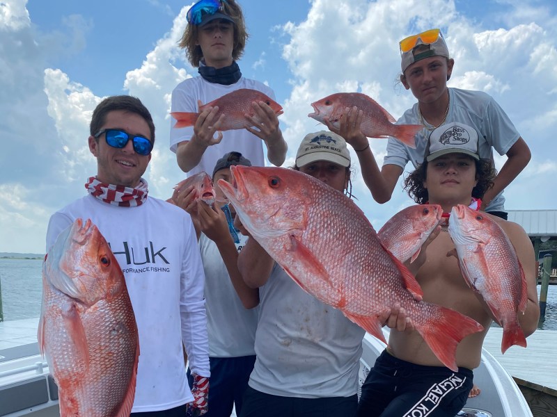 group of anglers with red snapper