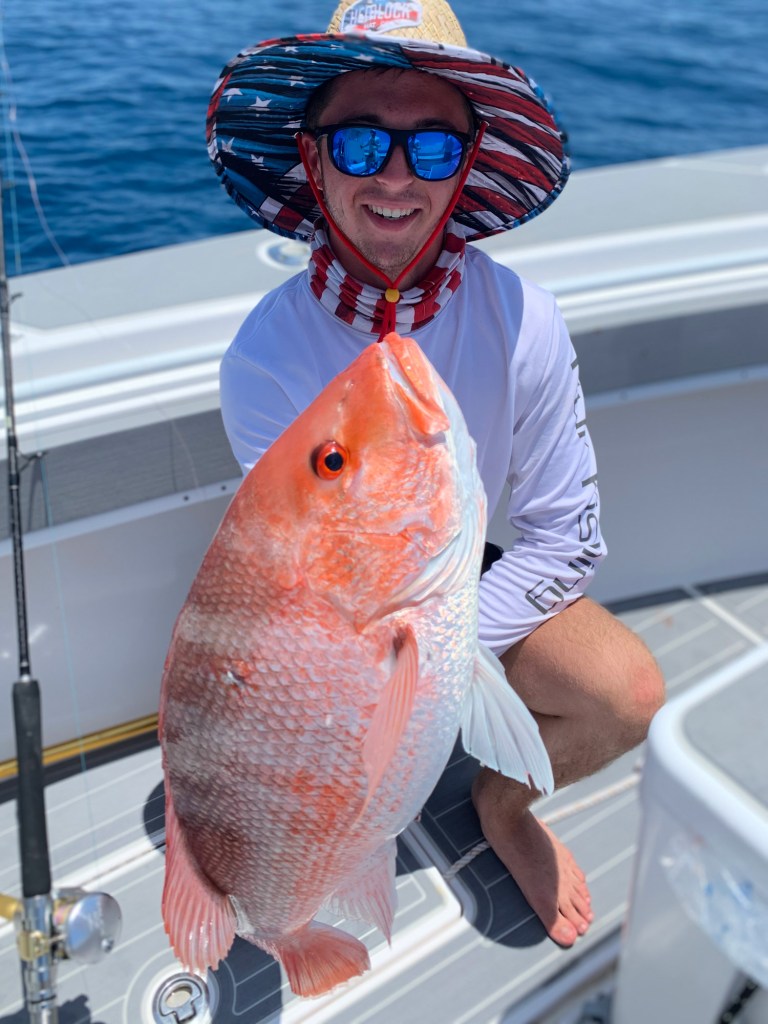 red snapper and angler