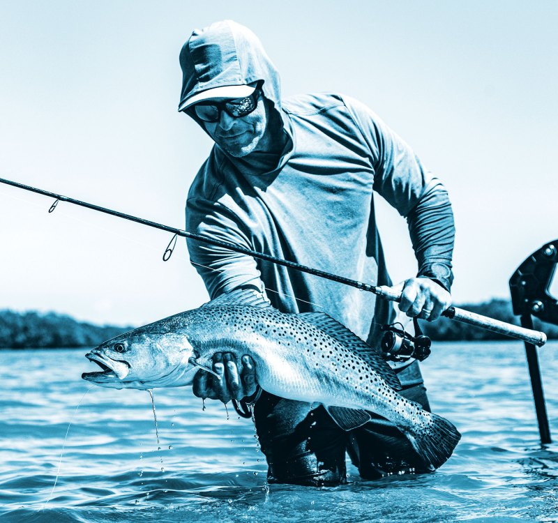 Angler with seatrout caught using Quantum tackle