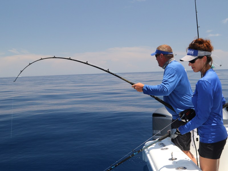 Angler fighting fish