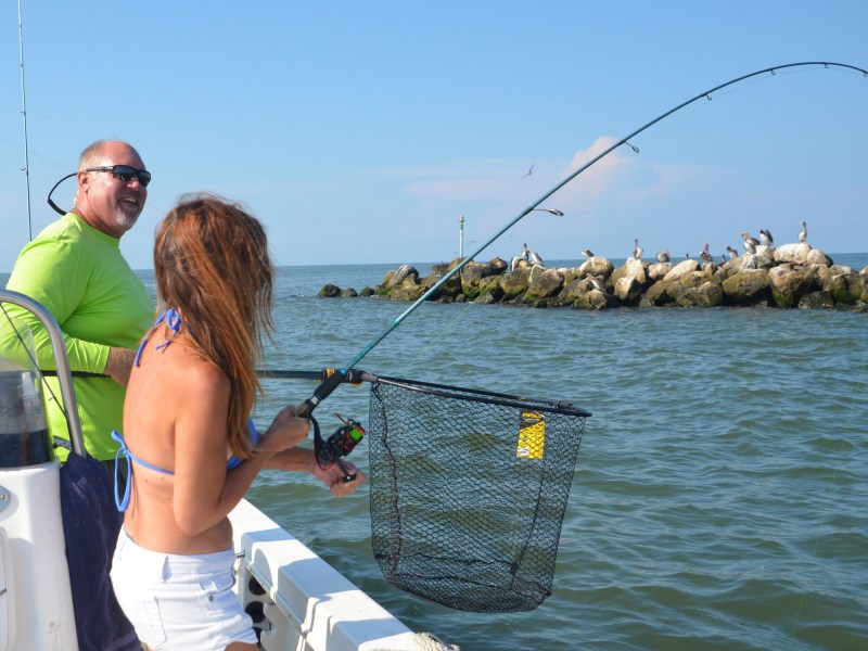 Lady angler fishing a jetty